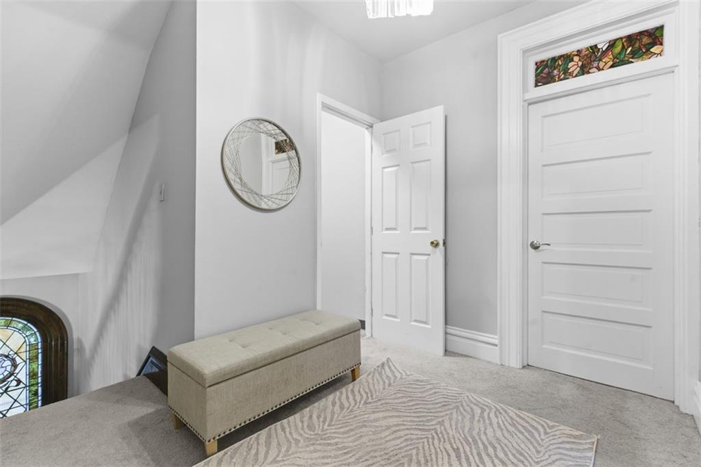 1336 4th Avenue Coraopolis, PA 15108 - Photo 27 of 50 a bedroom with a bed a couch and a window