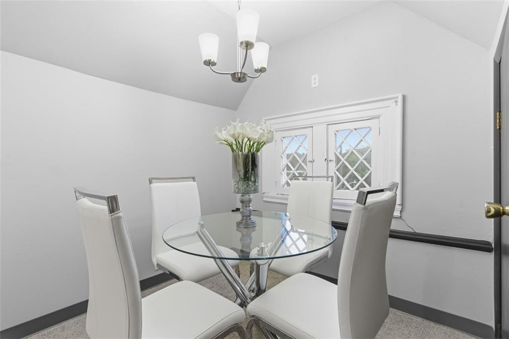 1336 4th Avenue Coraopolis, PA 15108 - Photo 34 of 50 a dining room with furniture and wooden floor