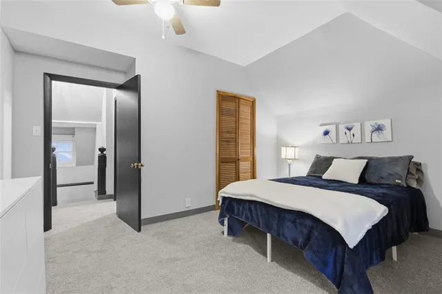 a bed room with a bed and a window