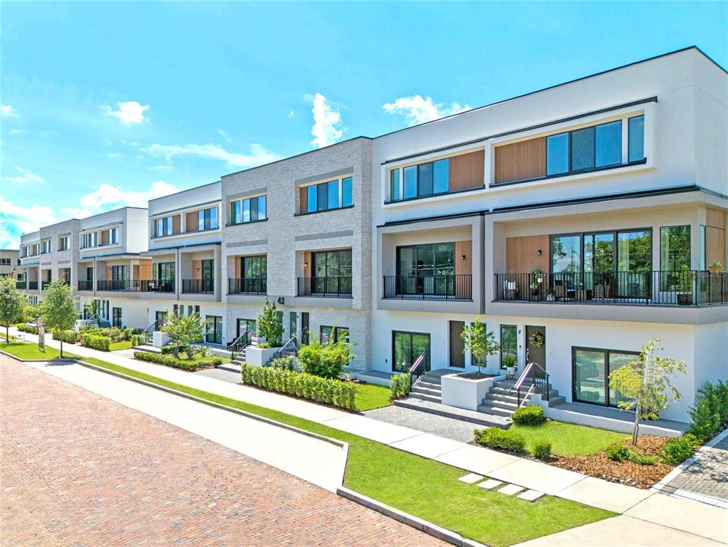 a view of a house with swimming pool and sitting area