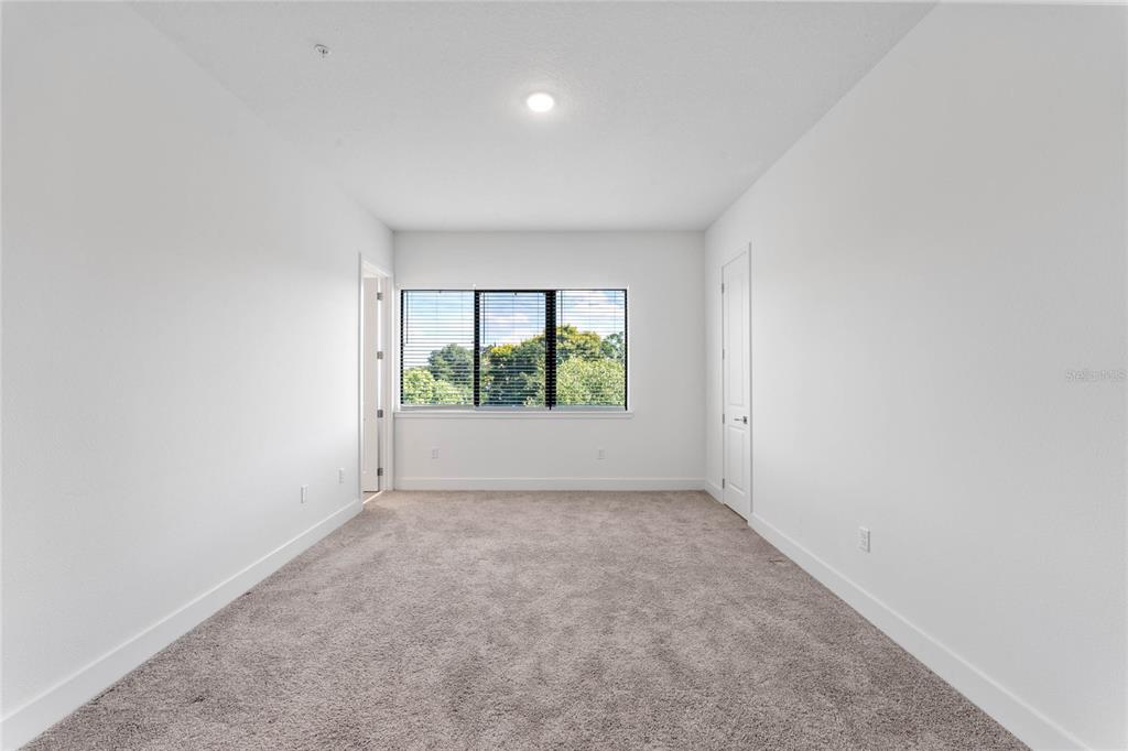 38 West Harding Street, Unit B Orlando, FL 32806 - Photo 17 of 27 an empty room with large window