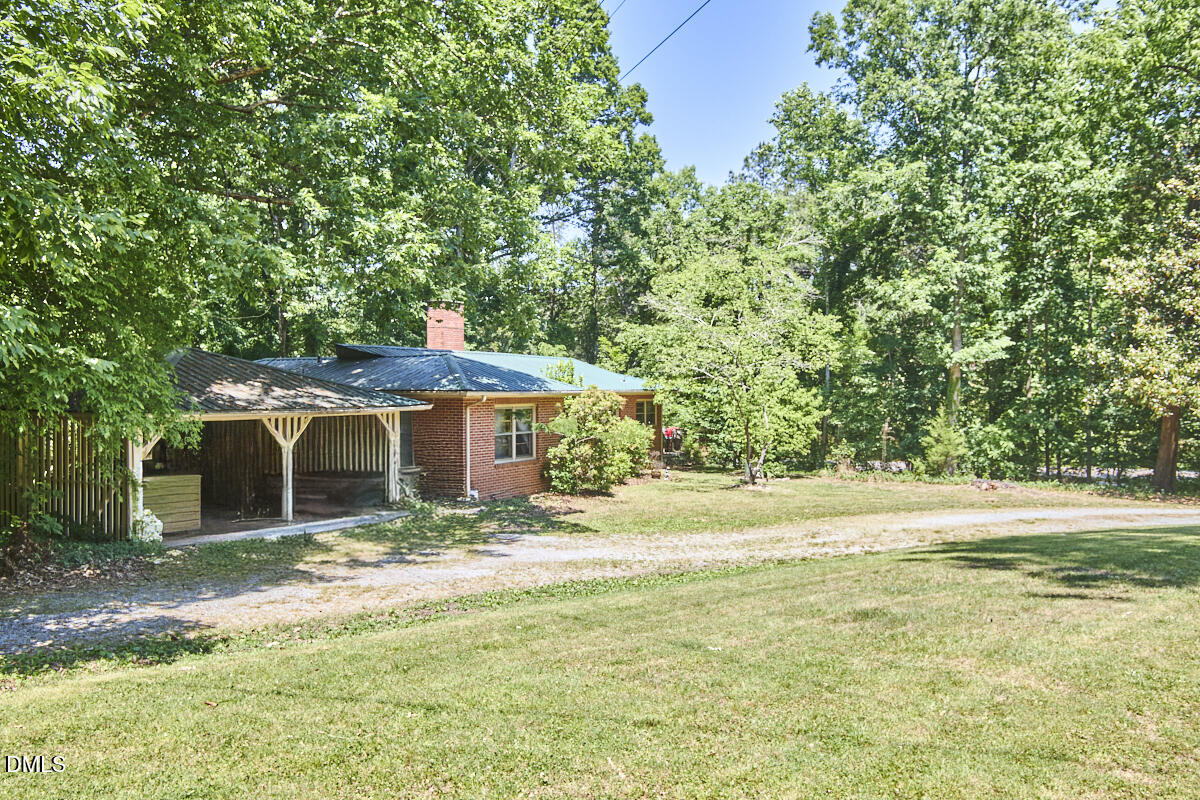 4204 Kerley Road Durham, NC 27705 - Photo 5 of 34 a backyard of a house with yard and outdoor seating