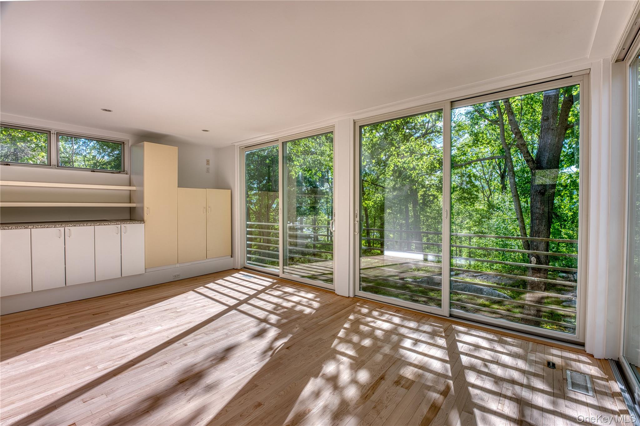 61 Indian Brook Road Garrison, NY 10524 - Photo 12 of 23 a view of a room with large windows