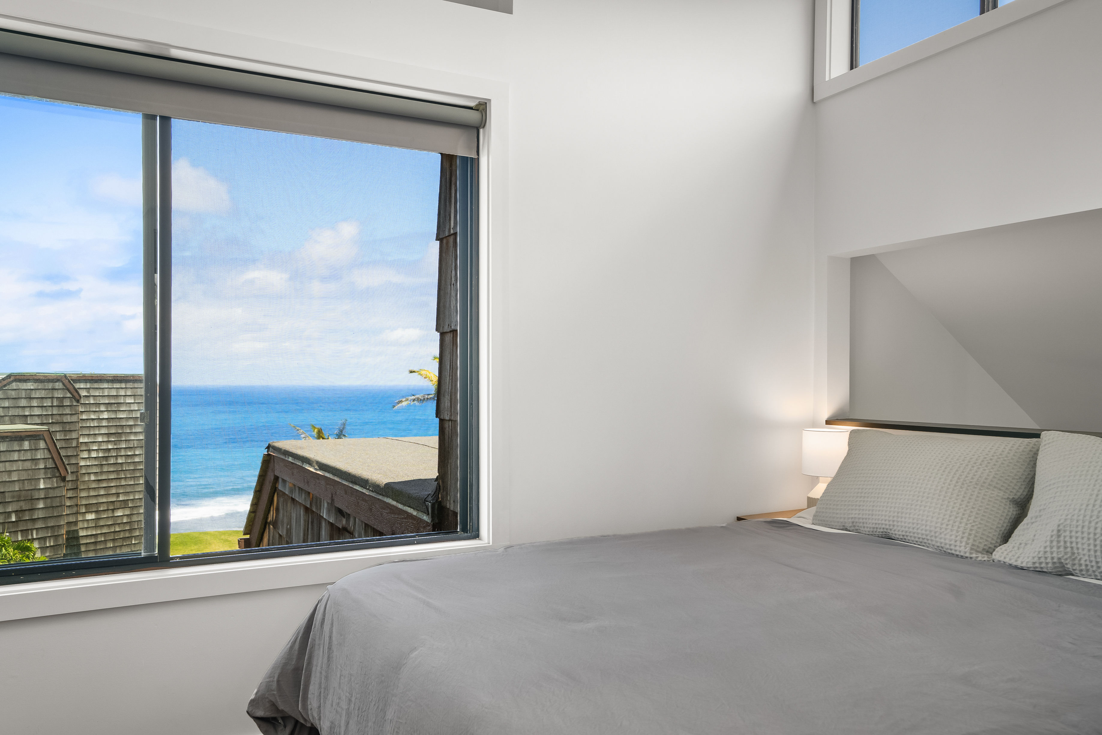 3700 Kamehameha Road, Unit F8 Princeville, HI 96722 - Photo 17 of 30 a bedroom with a large bed and a window