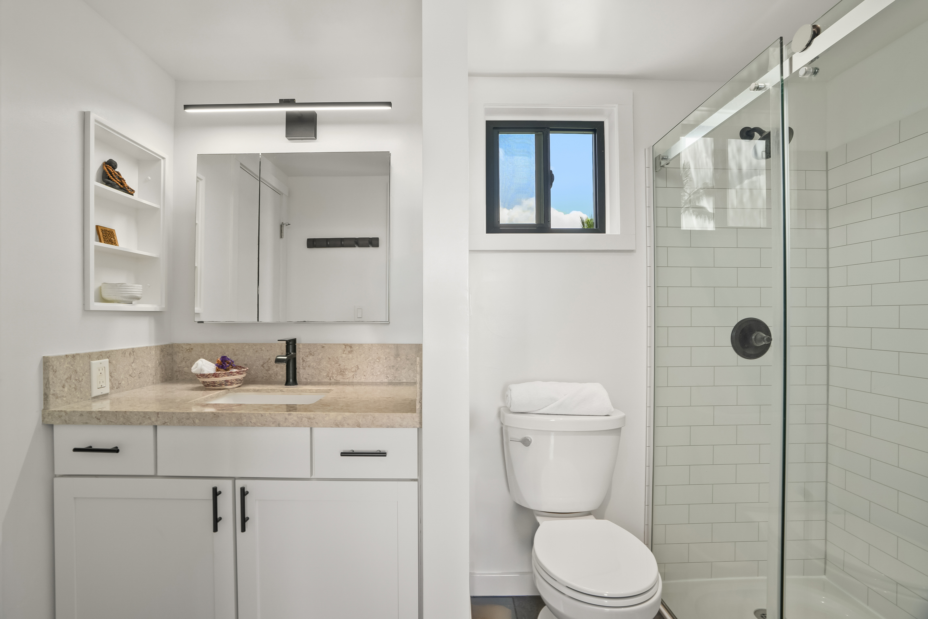 3700 Kamehameha Road, Unit F8 Princeville, HI 96722 - Photo 22 of 30 a bathroom with a toilet sink vanity granite and shower