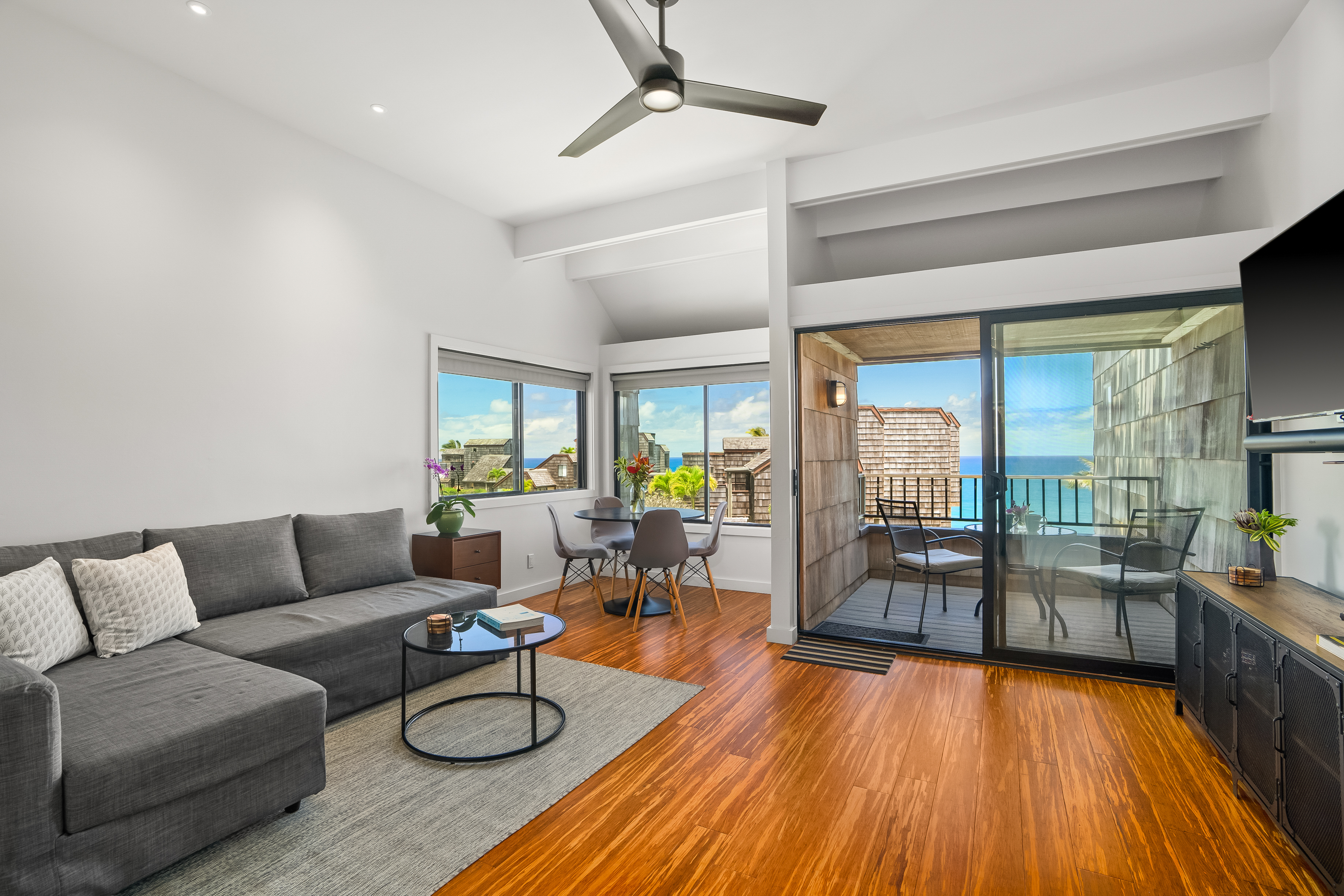 3700 Kamehameha Road, Unit F8 Princeville, HI 96722 - Photo 3 of 30 a living room with furniture and a wooden floor