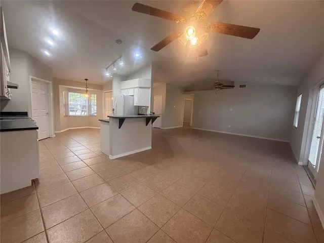 a view of a kitchen with electric appliances