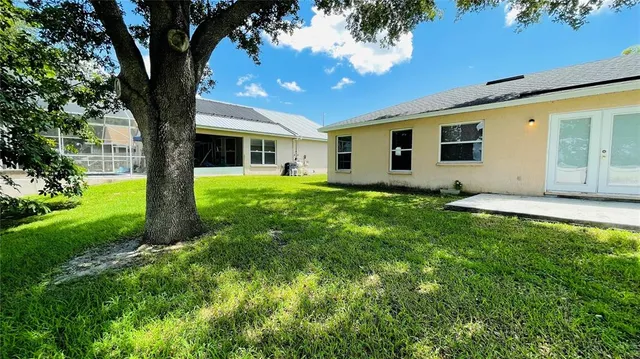 a sign that is sitting in front of flowers