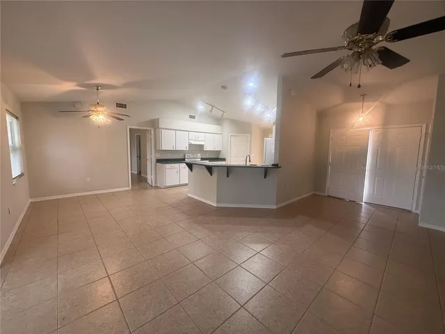 a view of a kitchen with a sink and cabinets