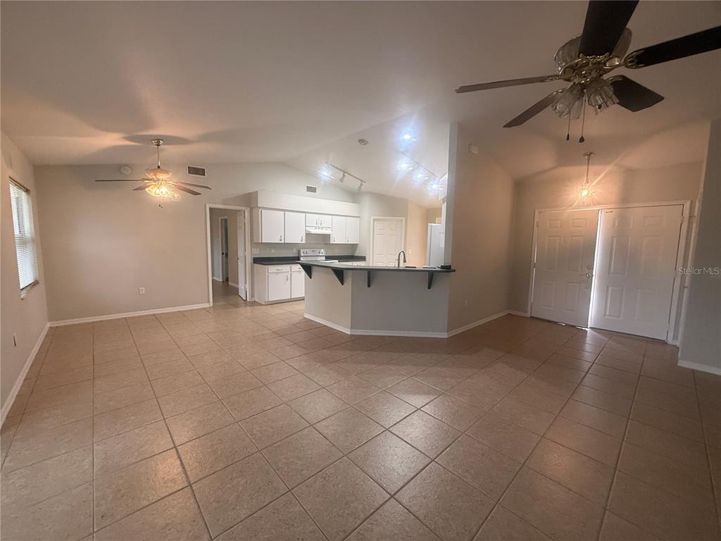 620 Reflections Loop West Winter Haven, FL 33884 - Photo 7 of 31 a view of a kitchen with a sink and cabinets