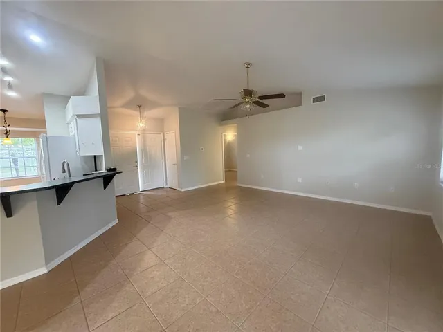 a view of a kitchen with a sink and cabinets