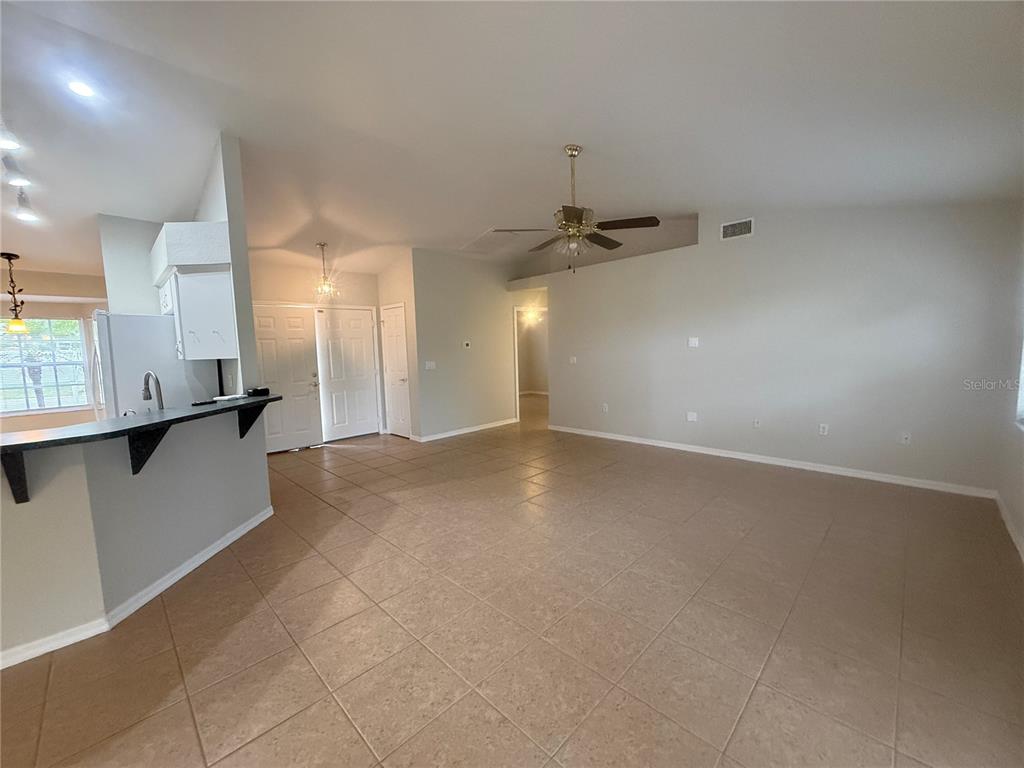 620 Reflections Loop West Winter Haven, FL 33884 - Photo 8 of 31 a view of a kitchen with a sink and cabinets