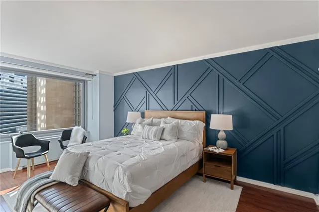 a bedroom with a bed and window