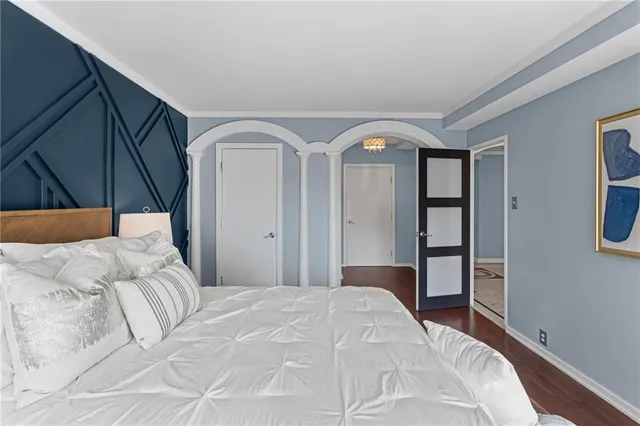 a bedroom with a bed and a closet