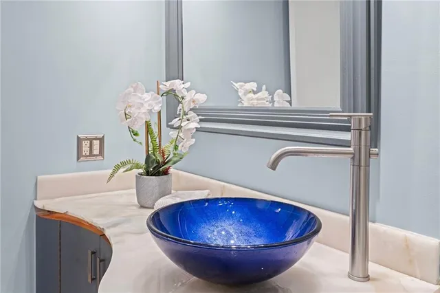 a view of a dining room with a table and chairs