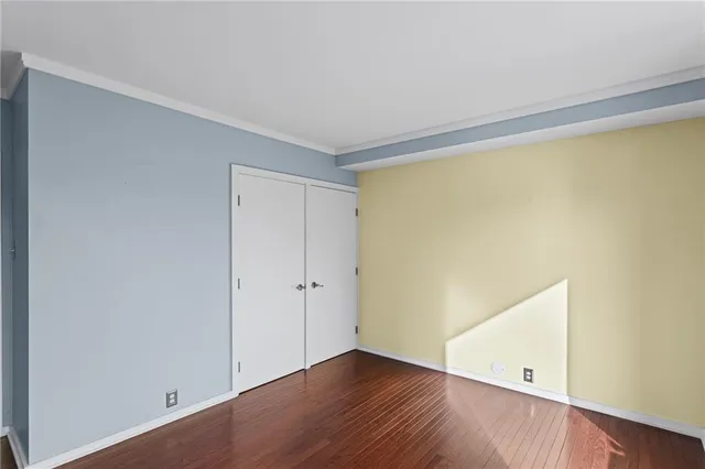 an empty room with wooden floor