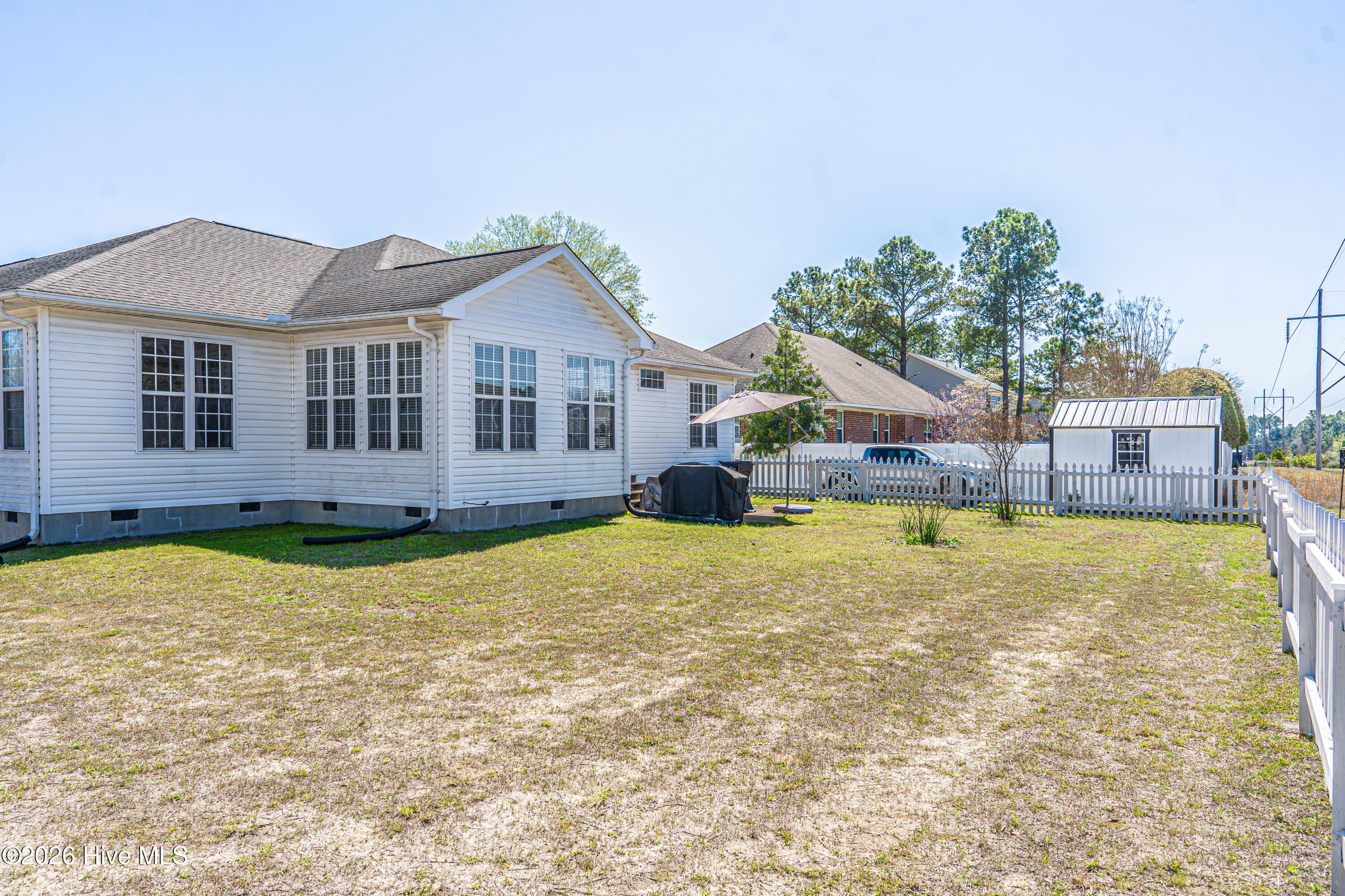 1320 Burning Tree Road Pinehurst, NC 28374 - Photo 54 of 65 Spacious backyard with detached storage building