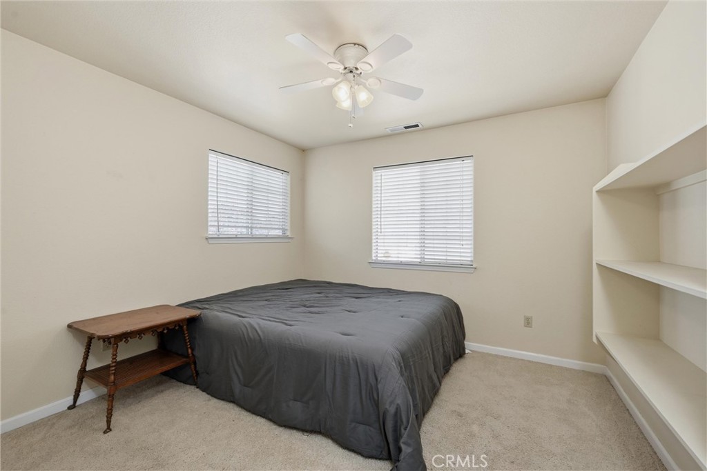 18846 Horseshoe Road Hidden Valley Lake, CA 95467 - Photo 17 of 31 a bedroom with a bed and a window