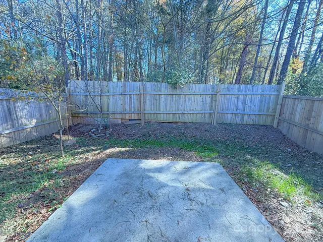 a view of outdoor space with wooden fence