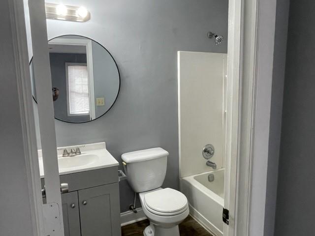 6721 Trafalger Square Norcross, GA 30093 - Photo 11 of 13 a bathroom with a toilet a sink and mirror