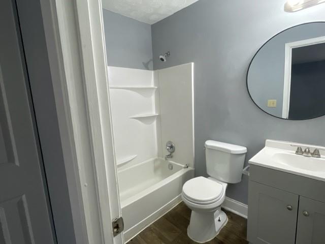 6721 Trafalger Square Norcross, GA 30093 - Photo 8 of 13 a bathroom with a toilet a sink and a mirror