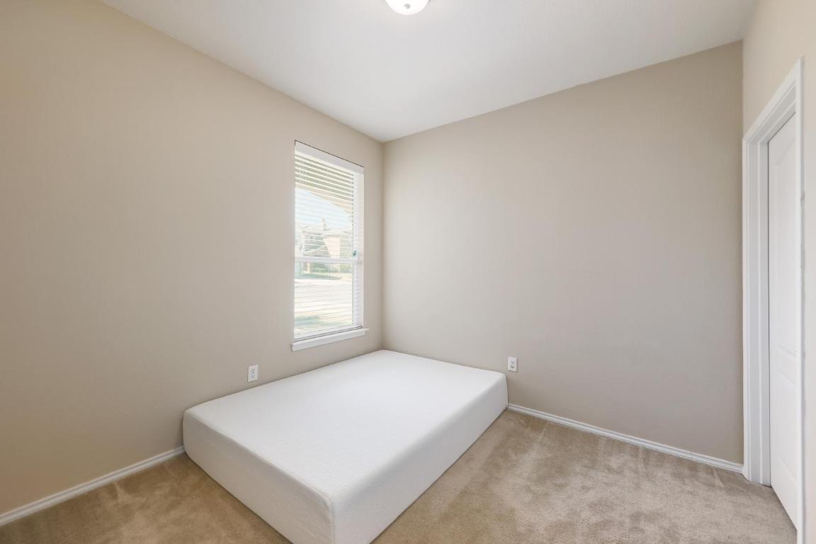 6300 Garden Rose Path Austin, TX 78754 - Photo 19 of 25 a view of an empty room and window