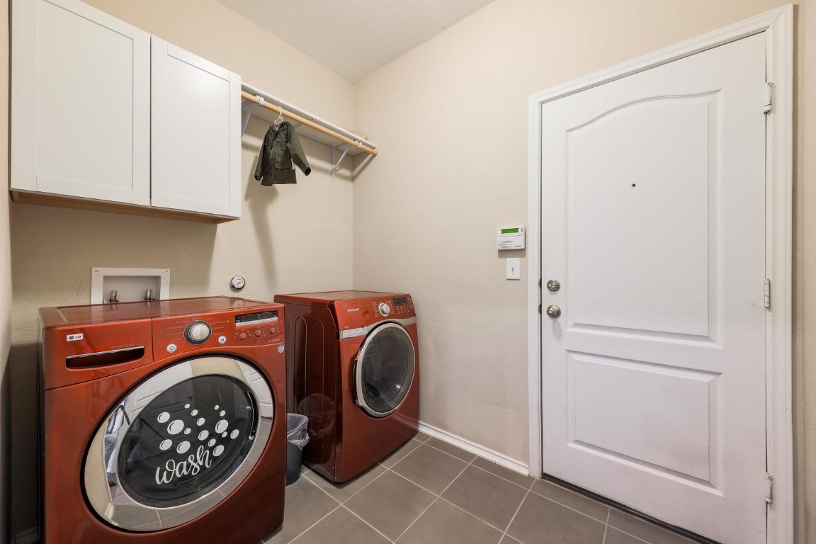 6300 Garden Rose Path Austin, TX 78754 - Photo 21 of 25 a utility room with dryer and washer