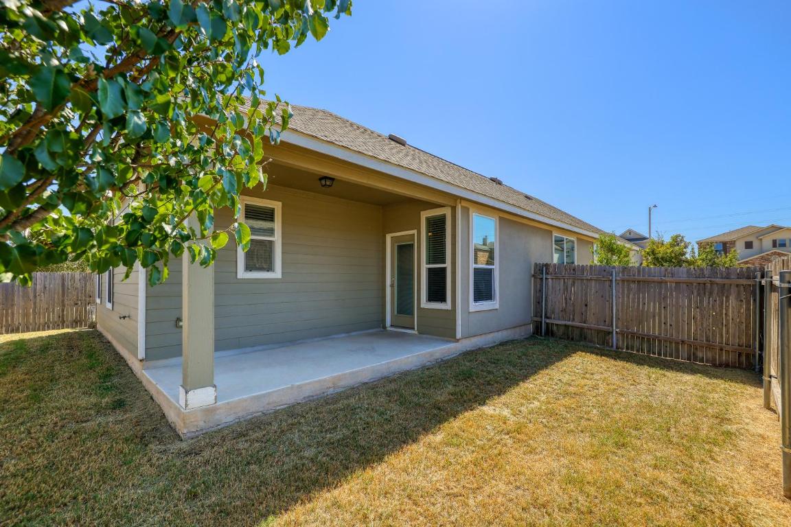 6300 Garden Rose Path Austin, TX 78754 - Photo 23 of 25 a view of a backyard with a large tree