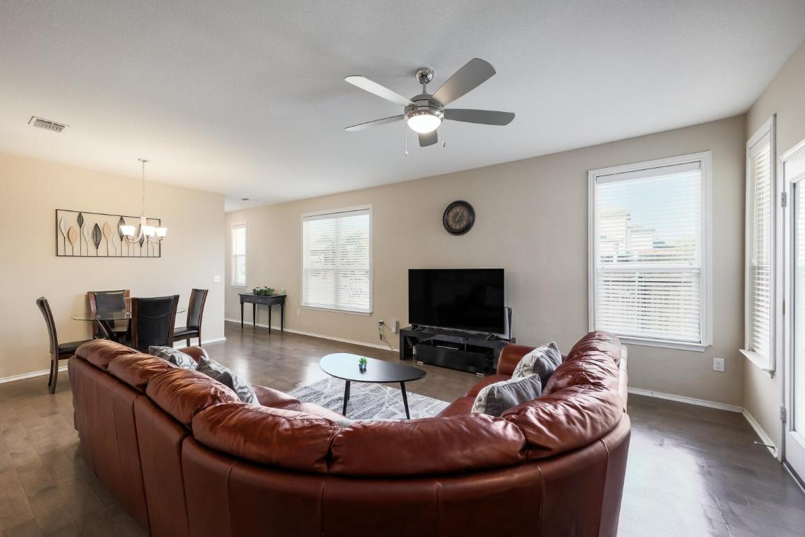 6300 Garden Rose Path Austin, TX 78754 - Photo 6 of 25 a living room with furniture and a flat screen tv