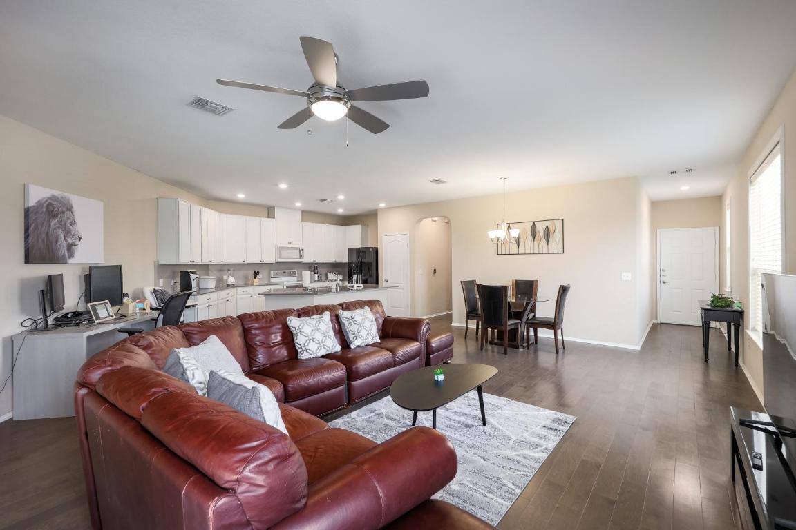 6300 Garden Rose Path Austin, TX 78754 - Photo 8 of 25 a living room with furniture and a view of kitchen