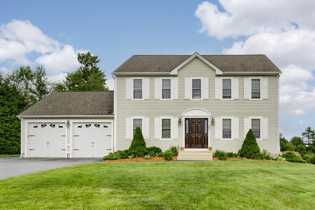 22 Vista Circle Rutland, MA 01543 - Photo 1 of 39 a front view of a house with a yard and garage