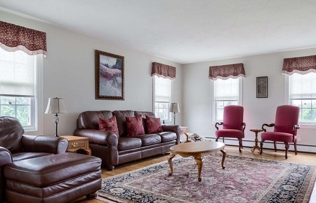 22 Vista Circle Rutland, MA 01543 - Photo 11 of 39 a living room with furniture a rug and a window