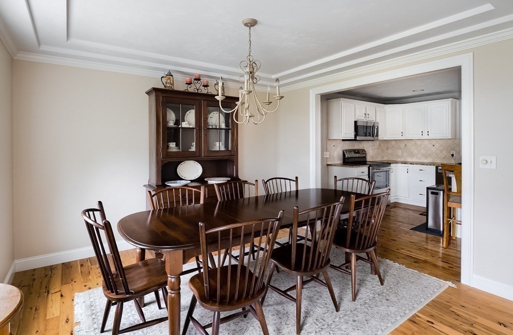 22 Vista Circle Rutland, MA 01543 - Photo 14 of 39 a view of a dining room with furniture and wooden floor