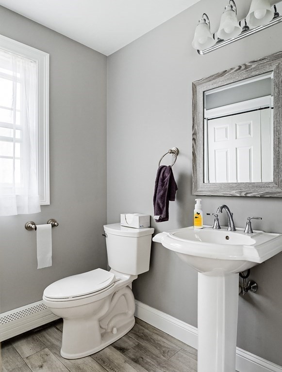 22 Vista Circle Rutland, MA 01543 - Photo 16 of 39 a bathroom with a toilet sink and mirror