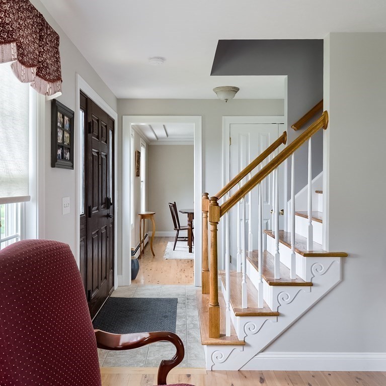 22 Vista Circle Rutland, MA 01543 - Photo 17 of 39 a view of entryway and hall with wooden floor