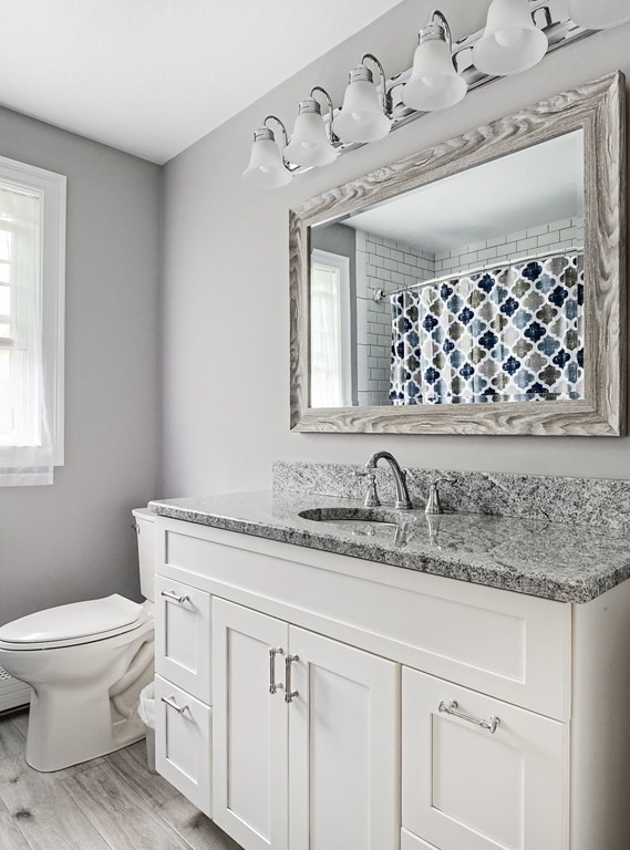 22 Vista Circle Rutland, MA 01543 - Photo 26 of 39 a bathroom with a granite countertop toilet sink and mirror