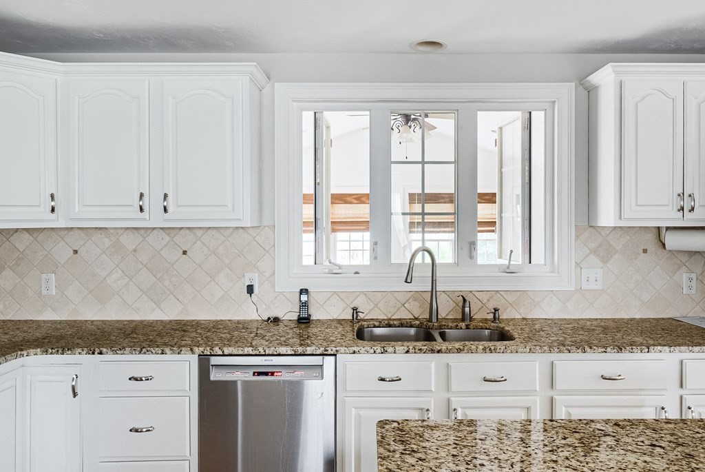 22 Vista Circle Rutland, MA 01543 - Photo 3 of 39 a kitchen with granite countertop white cabinets and sink