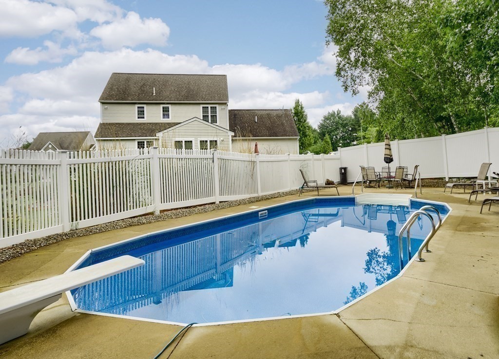 22 Vista Circle Rutland, MA 01543 - Photo 35 of 39 a view of a swimming pool with a lounge chair