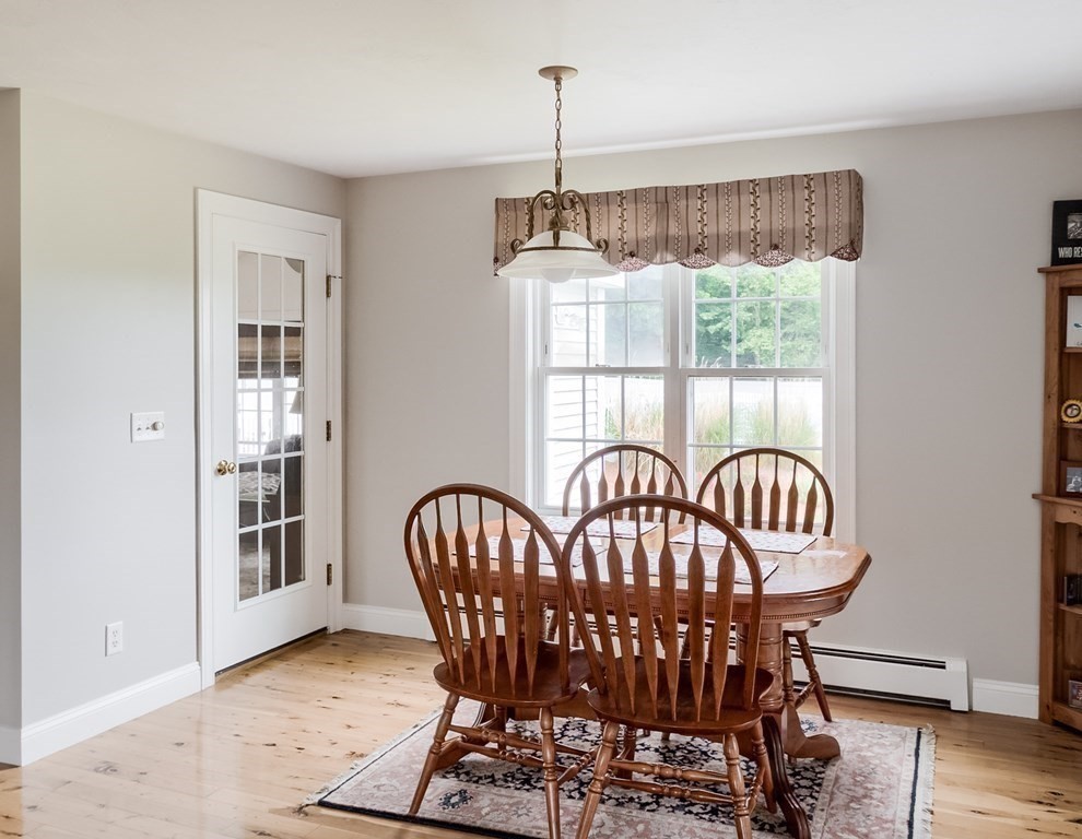 22 Vista Circle Rutland, MA 01543 - Photo 8 of 39 a view of a dining room with furniture window and wooden floor