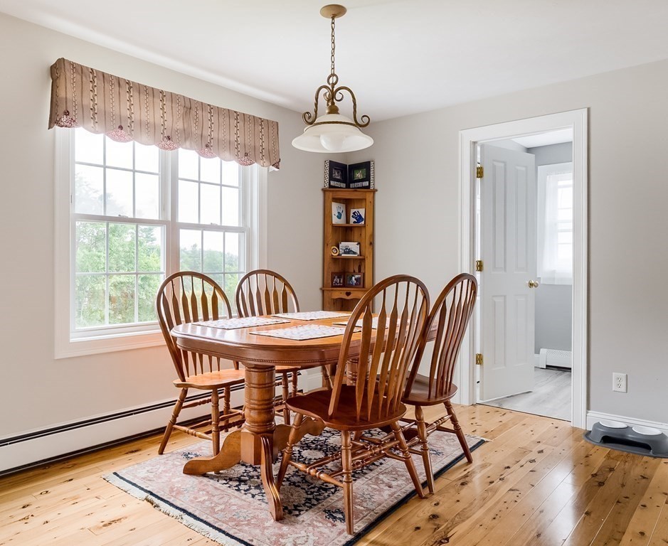 22 Vista Circle Rutland, MA 01543 - Photo 9 of 39 a view of a dining room with furniture wooden floor and chandelier