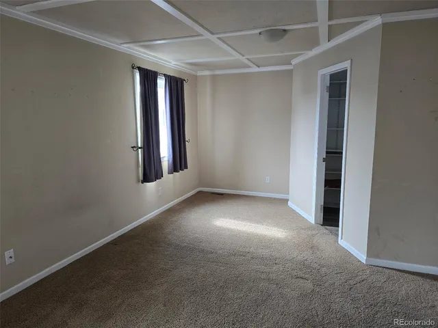 a view of a room with a small window