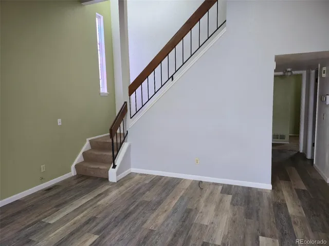 a view of entryway with wooden floor