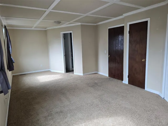 a view of empty room with windows