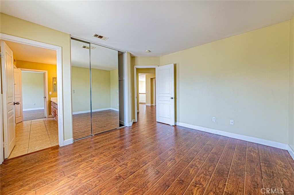 955 Blackberry Lane Carson, CA 90746 - Photo 19 of 53 a view of an empty room and wooden floor