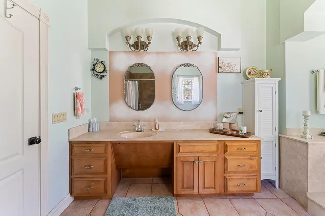 a bathroom with a double vanity sink and a mirror