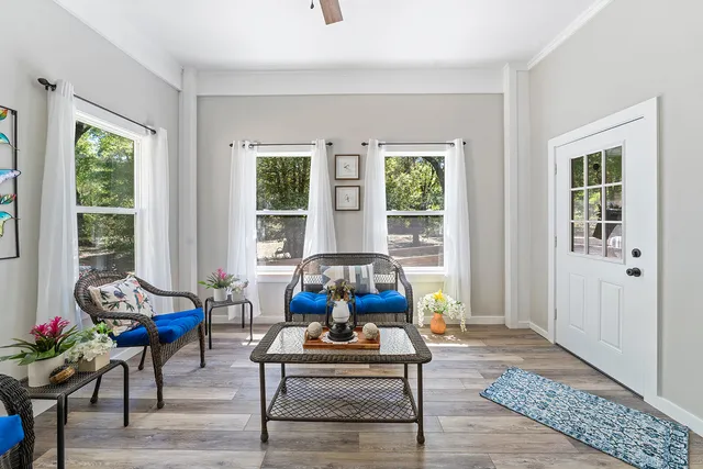 a living room with furniture and a window