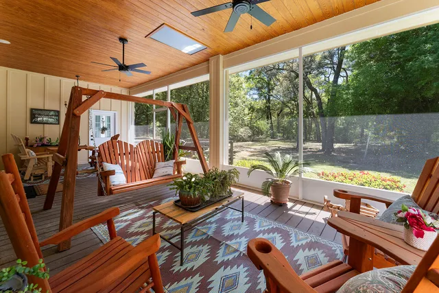 a view of swimming pool with furniture