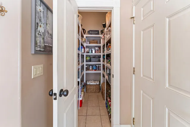 a view of a hallway with shelves