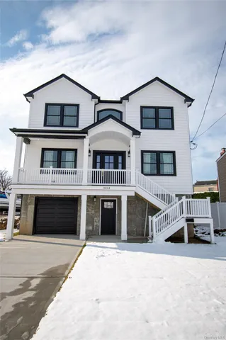 a front view of a house with a garage