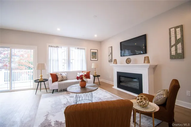 a kitchen with kitchen island granite countertop a sink a stove and a chandelier